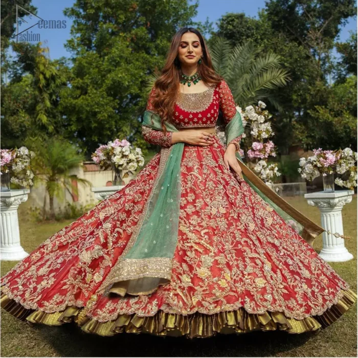 Make a special day even more magic with our exquisite bridal dress. This wedding dress is elegant and eye-catching in equal measure. Strike a breathtakingly elegant pose in this wedding dress, designed with a beautiful neckline embellished with sequins details and scattered tiny floral motifs all over. The lehenga is decorated with floral embroidery all over and finished with frilled fabric. The mint green organza dupatta with chann and finishing all around the edges makes the look complete.