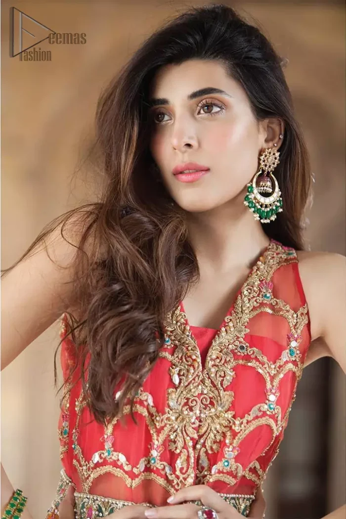 This artisanal piece is rendered in grace and timelessness. Brighten up your look with this mix of floral and geometrical embroidery in vibrant tones spread across on red and orange canvas. The front open pishwas is delicately crafted with zardozi work, multiple color embroidery and mirror work. Furthermore it is also adorned with green embellished applique and the colorful applique lift the whole bottom. It comprises with orange sharara. Finished the dress with red and orange organza dupatta with geometric patterns on the ground.