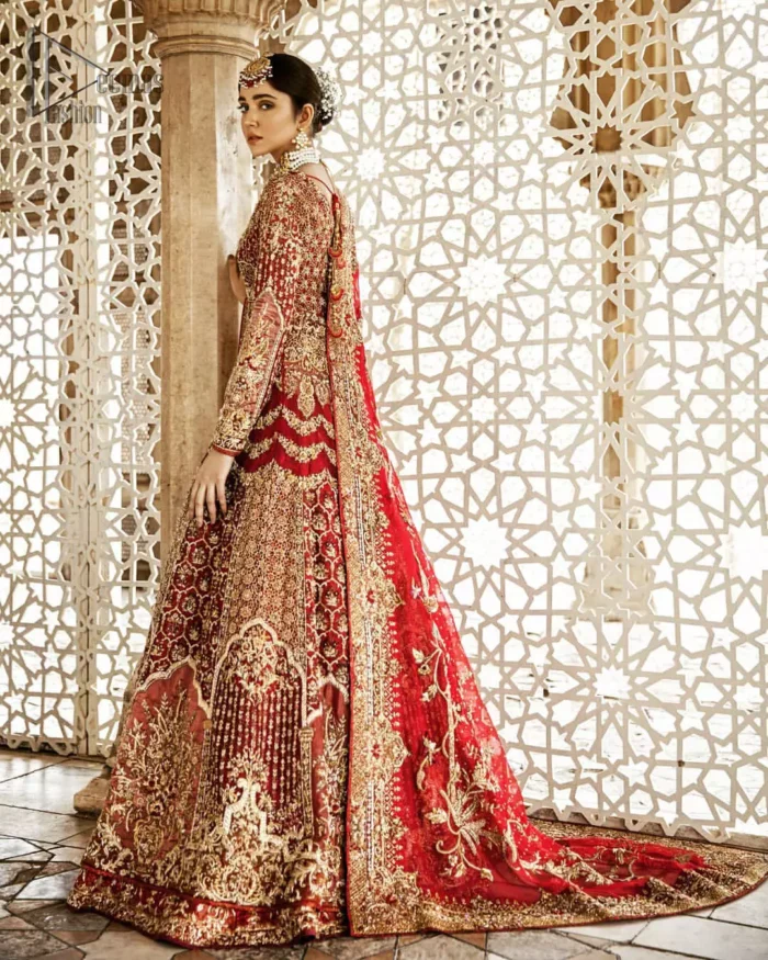 Captured in traditional silhouette, This traditional red pishwas is aesthetically designed with motifs,geometric and floral patterns, embellished with kora, dabka, tilla and sequins work. It comes with full embellished lehenga which is gorgeously handcrafted with golden and antique shaded zardozi work. The piece comes with a handcrafted belt. It is coordinated with net dupatta which is sprinkled with sequins all over it. It is further furnished with four sided border and floral bunches.