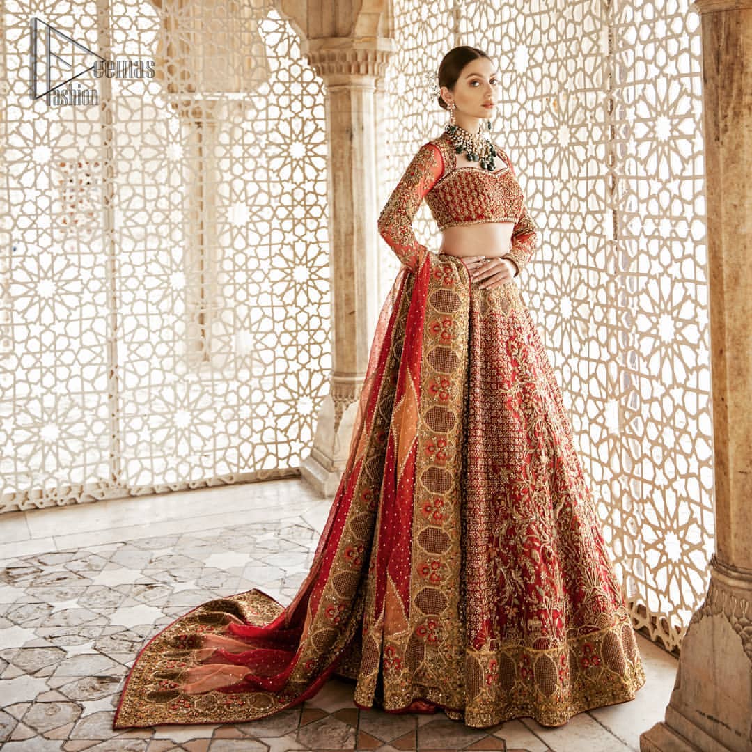 Classic, timeless and truly beautiful, our bridal dress is perfect for your unforgettable day. This exceptionally detailed dress is cut in a seductive fit and flare silhouette that’s sure to turn heads. The blouse is adorned with antique shaded kora, dabka, tilla, kundan, sequins and pearls. Coordinated with traditional red lehenga having geometric patterns and floral embroidery ornamented with antique shaded zardozi work. The hemline is also adorned with vibrant floral motifs. Elegance is personified when it gets paired up with red organza dupatta having four sided thick embellished border.