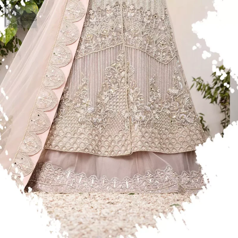 Make a special day even more magic with our exquisite flora bridal maxi dress. Discover classic look in this outfit for a traditional style, with delicate detailing and intricate accents for a subtle yet sophisticated look, having full sleeves with zardozi details. Furthermore the hemline is emphasized with a large central motif and small motifs around it that gives perfect ending to the outfit. It comes with tea pink lehenga with zardozi details on the bottom. Paired with light purple net dupatta sprinkled with sequins and four sided embellished border that gives the right amount of glamour to the outfit.