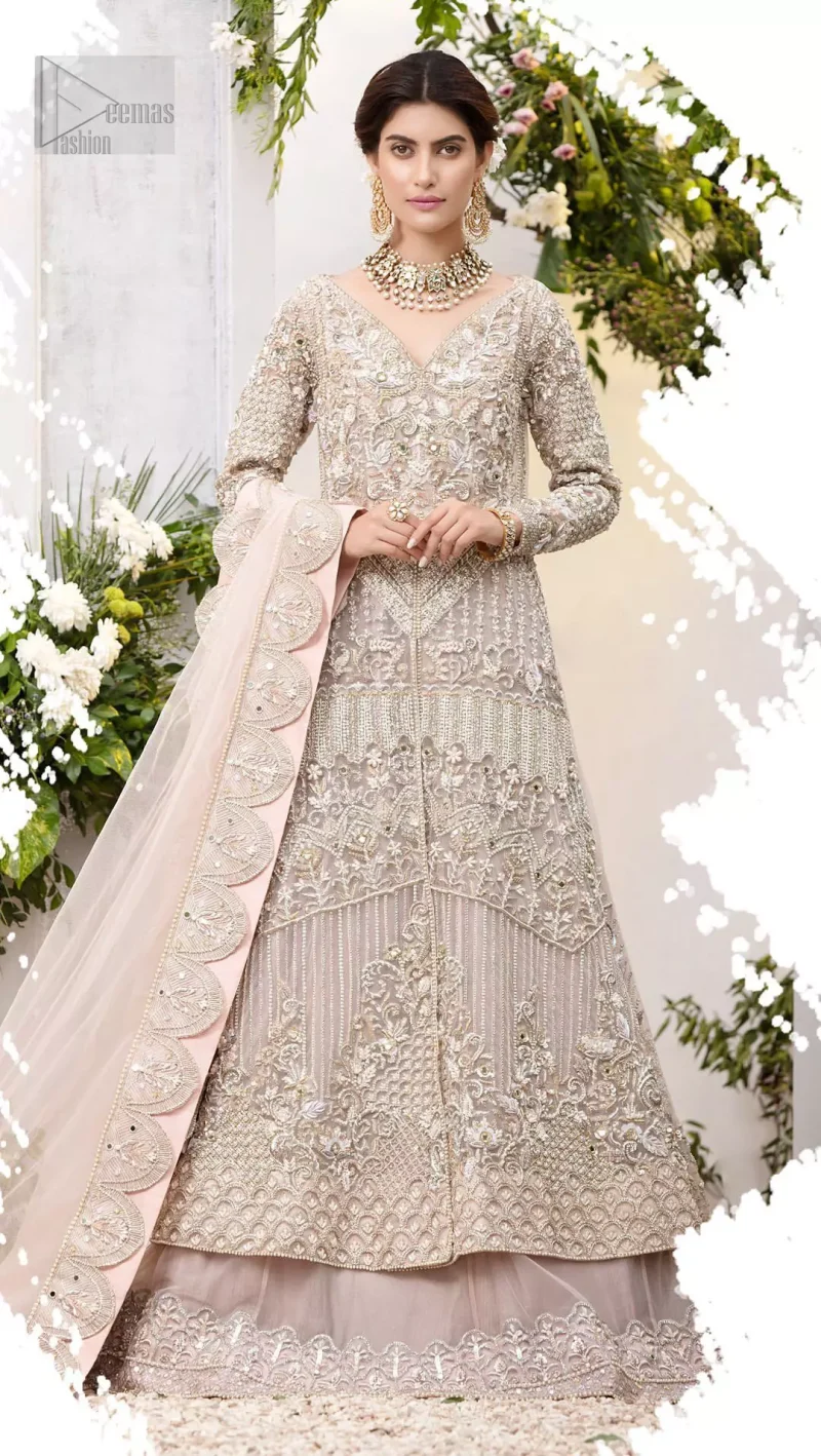Make a special day even more magic with our exquisite flora bridal maxi dress. Discover classic look in this outfit for a traditional style, with delicate detailing and intricate accents for a subtle yet sophisticated look, having full sleeves with zardozi details. Furthermore the hemline is emphasized with a large central motif and small motifs around it that gives perfect ending to the outfit. It comes with tea pink lehenga with zardozi details on the bottom. Paired with light purple net dupatta sprinkled with sequins and four sided embellished border that gives the right amount of glamour to the outfit.