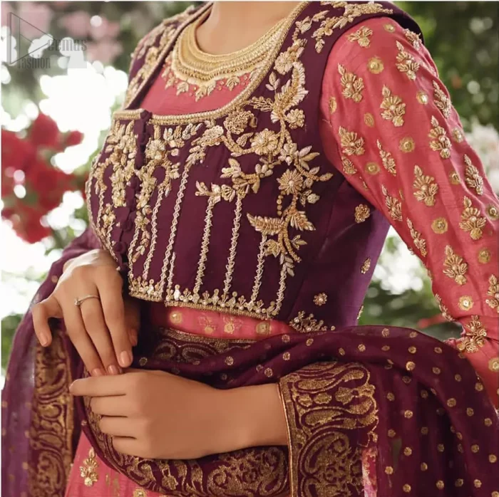 This exceptionally detailed dress is cut in a seductive fit and flare silhouette that’s sure to turn heads. Discover classic look with coral pishwas adorned with delicate detailing and intricate accents for a subtle yet sophisticated look, including long sleeve with tiny floral booties details. The neckline is doecorated with dull golden zardozi work and scattered tiny floral booties all over the pishwas. This outfit is coordinated with dark magenta bolero jacket which is beautifully ornamented with dull golden kora, dabka detailing. Paired it up with coral churidar pajama and dark magenta self printed dupatta.
