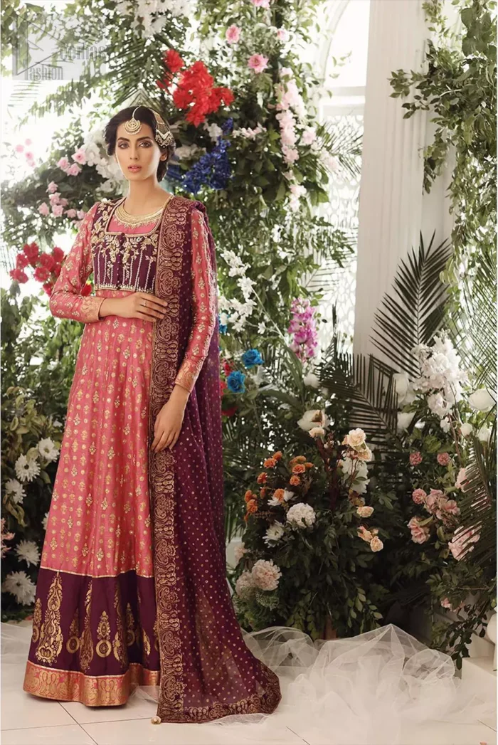 This exceptionally detailed dress is cut in a seductive fit and flare silhouette that’s sure to turn heads. Discover classic look with coral pishwas adorned with delicate detailing and intricate accents for a subtle yet sophisticated look, including long sleeve with tiny floral booties details. The neckline is doecorated with dull golden zardozi work and scattered tiny floral booties all over the pishwas. This outfit is coordinated with dark magenta bolero jacket which is beautifully ornamented with dull golden kora, dabka detailing. Paired it up with coral churidar pajama and dark magenta self printed dupatta.