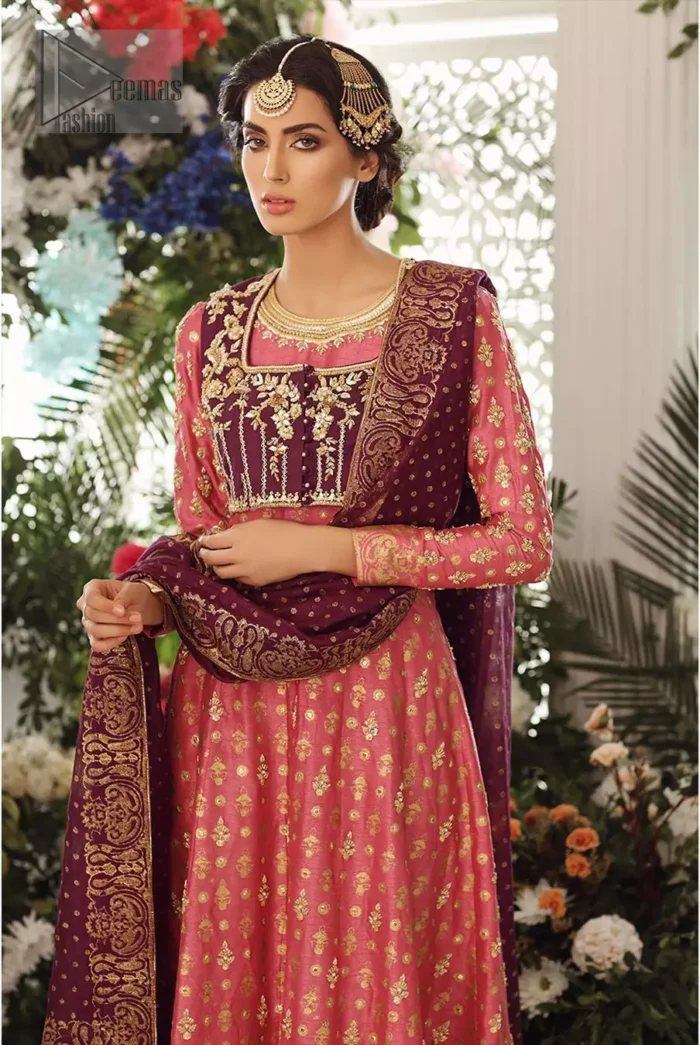 This exceptionally detailed dress is cut in a seductive fit and flare silhouette that’s sure to turn heads. Discover classic look with coral pishwas adorned with delicate detailing and intricate accents for a subtle yet sophisticated look, including long sleeve with tiny floral booties details. The neckline is doecorated with dull golden zardozi work and scattered tiny floral booties all over the pishwas. This outfit is coordinated with dark magenta bolero jacket which is beautifully ornamented with dull golden kora, dabka detailing. Paired it up with coral churidar pajama and dark magenta self printed dupatta.