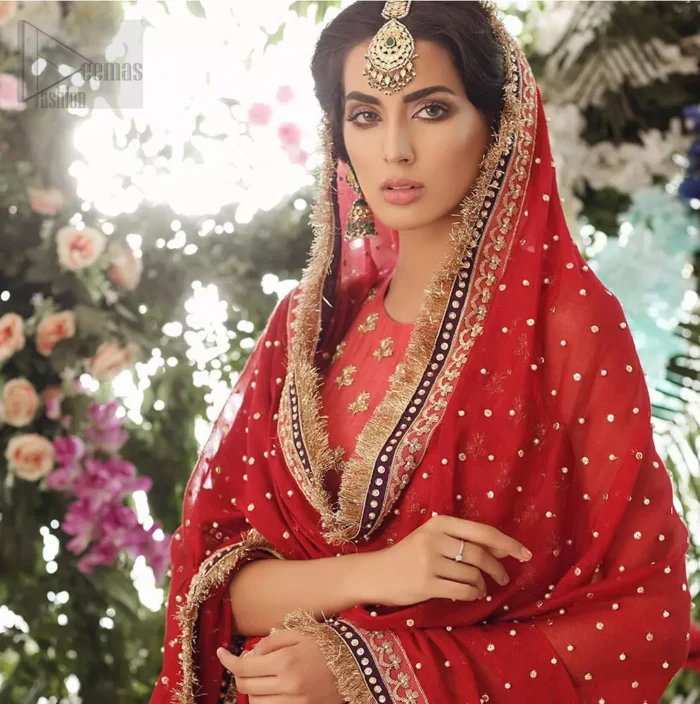 A perfect ensemble for this festive season with divine detailing of zardozi work. This outfit is an immensely captivating traditional piece, enhancing the art of classical heritage showcasing the craftsmanship of golden kora, dabka & tilla detailed with sequins, artistically embellished to give a beautiful rhythm to the outfit. Furthermore, the tiny floral booties scattered along the length. Complete the look with magenta churidar pajama and red chiffon dupatta adorned with sequins spray all over and four sided lace border.