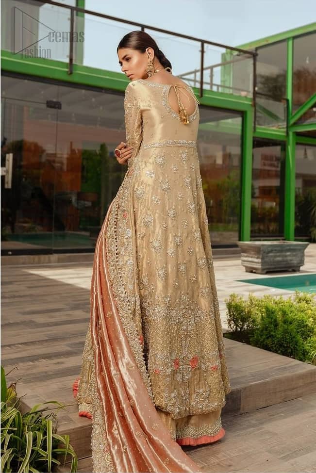 Nothing speaks of femininity and class louder than this outfits for bridesmaids. It is highlighted with golden and silver kora, dabka, tilla, sequins and pearls. The maxi is heavily ornamented with floral jaal done with zarozi work and floral motifs are decorated with peach and ivory thread embroidery. It comes with fawn lehenga adorned with scalloped embroidered bottom. Furthermore, lehenga is enhanced with peach frilled bottom. It is coordinated with peach dupatta which is sprinkled with sequins all over it. It is further furnished with four sided thick border.