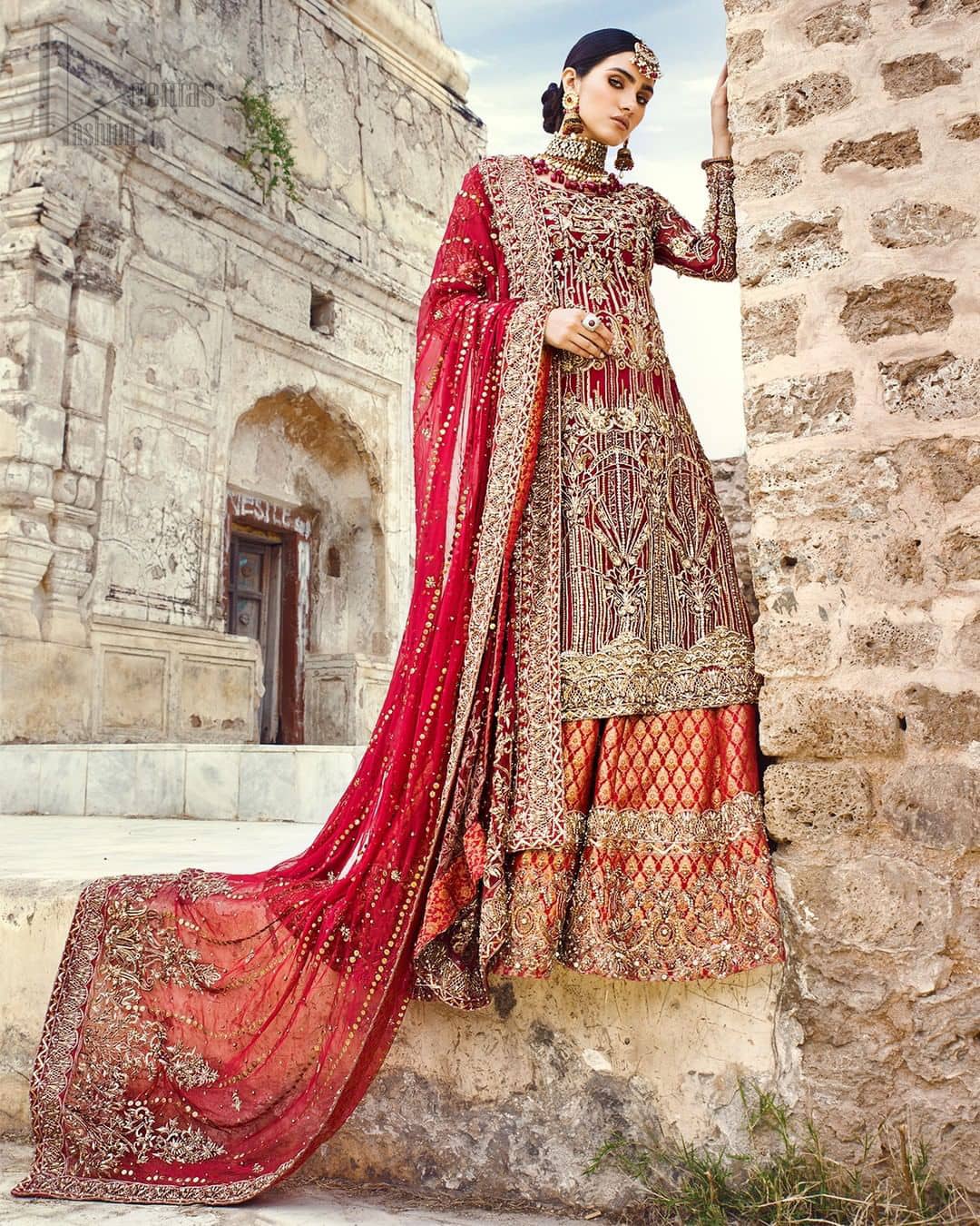 You are all set to make a lasting impact with the divine royalty of this dress. This beautiful dress comes with a maroon back train lehenga with beautiful embellishment around the hem. The shirt is adoned with golden zardozi work around the neckline and vertically worked gold lines and it finished with a thick embellished border. The sleeves are embellished with motifs all over along with a thick embroidered border. The dupatta incorporates beautifully designed borders on all four sides, focusing on the heavily embellished pallu borders to give it a perfect maharani look.