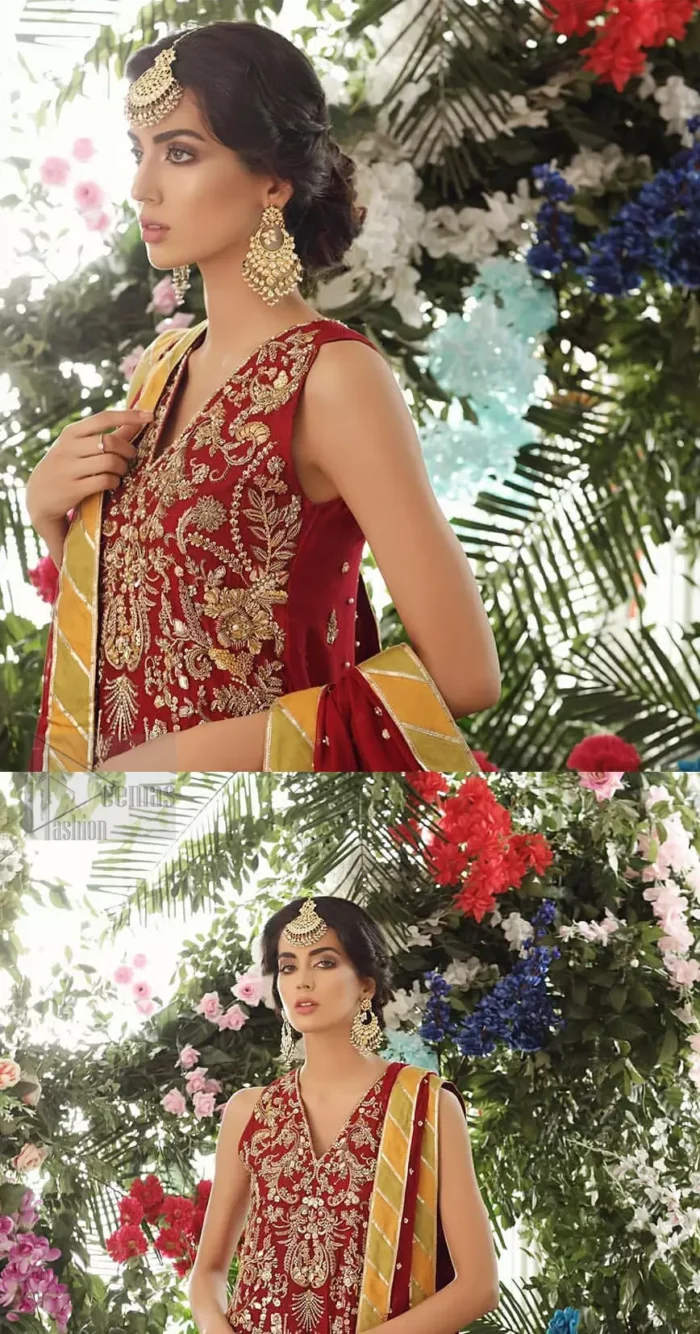 Tradition meets modernity. Boost your confidence and style in this glamorous attire accentuated with finest zardozi work embroidery and scalloped borders with dandling pearls. This maroon sleeveless shirt is ornamented with golden and light golden zardozi work. The scalloped hemline is decorated with dangling pearls. Style it confidently with maroon sharara adorned with beautiful gota work. It is paired with an ethereal maroon dupatta with scattered sequins all over and four sided applique borders.