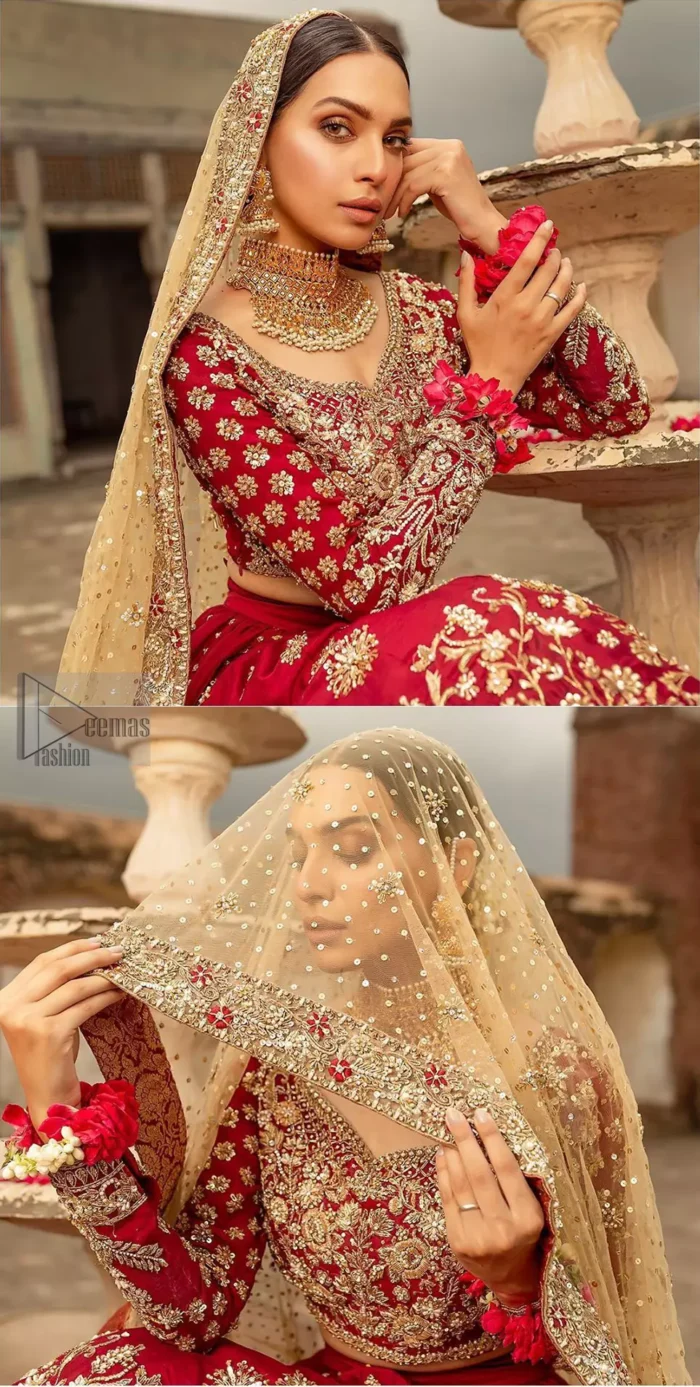 Our deep red bridal dress will make your special day even more perfect. Infused with classical glamour. Strike a breathtakingly elegant pose in this wedding dress. This artisan piece includes intricate hand embellishment. This highly skilled technique involves hand needle work to add beads and sequins to the fabric, giving your garments a unique look. The embroidery is done in the shades of light golden, antique and maroon thread work. The blouse is fully embellished and lehenga is adorned with floral details all over and thick embellished bottom. Furthermore the lehenga is also intensified with sprinkled floral motifs. Complete the look with golden net dupatta enhanced with sprinkled sequins on the ground and four sided embellished border.