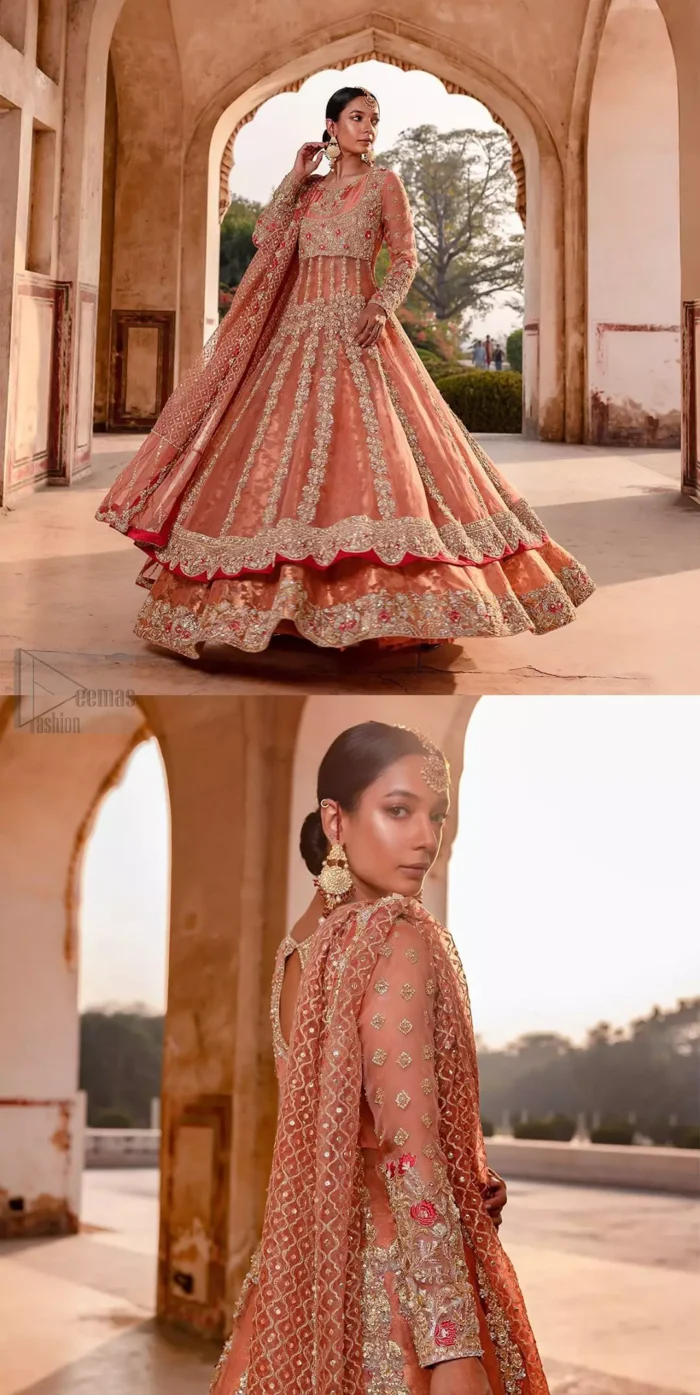 You are all set to make a lasting impact with the divine royalty of this dress. This garment is sure to make you look like glamorous with immaculate work covering every inch of the pishwas with multiple panels. This pishwas made of zardozi work with scalloped hemline and applique is everything that you need for your festivities. The brocade lehenga is beautifully adorned with thick embellished bottom with zardozi work in the shades of silver and gold. Style it up with peach organza dupatta with criss-cross patterns and floral booties on borders. This is an ensemble that deserves to be flaunted.
