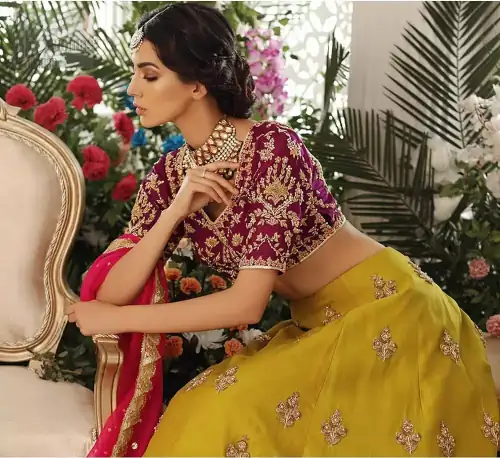 Adorn yourself with this breath-taking mehndi lehenga outfit. This beautiful mehndi dress comes with yellow lehenga with scattered beautiful embellished