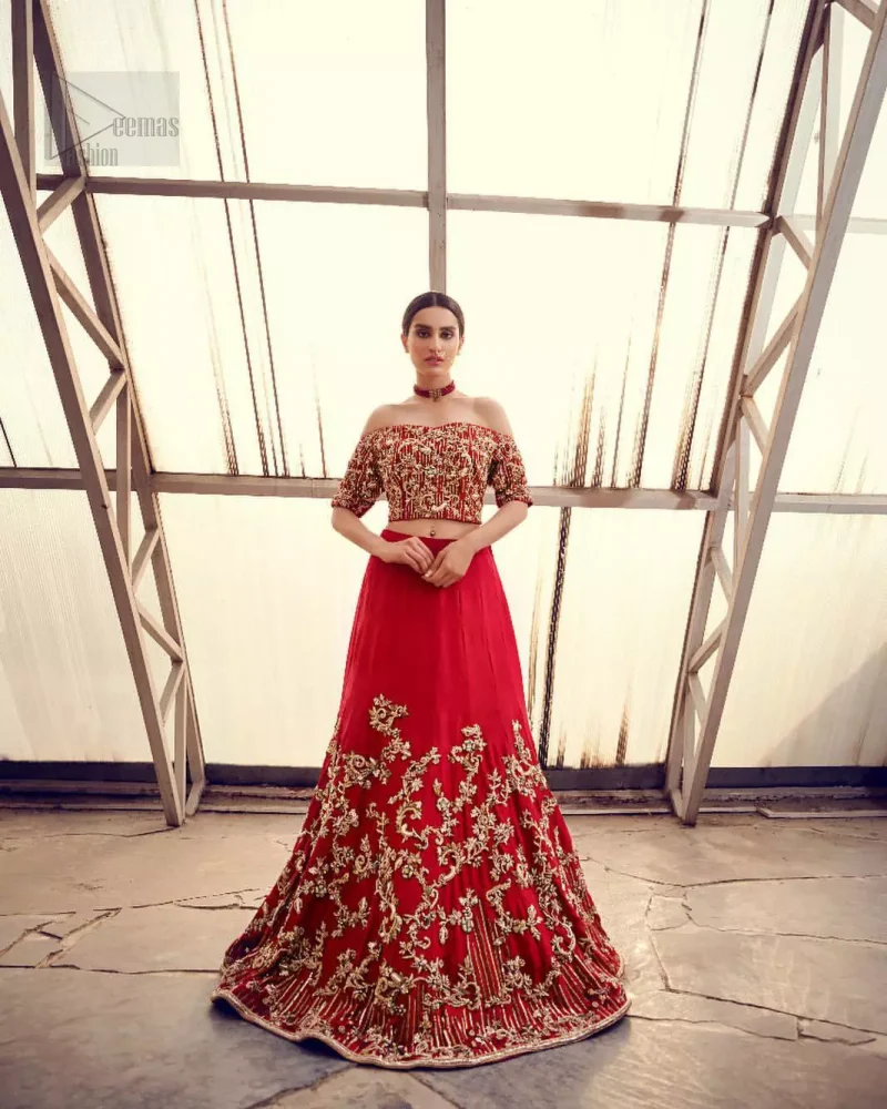Captured in traditional silhouette, The bridal stands out due to its uniqueness and the perfect fusion of modern cut and traditional embroidery. This dress is beautifully decorated with heavy embroidery. It is highlighted with kora, dabka, tilla, sequins and pearls. Off shoulder blouse is enhanced with zardosi work all over. It comes with full embellished lehenga adorned with floral booties and vertical lines all over it. It is coordinated with net dupatta which is sprinkled with sequins all over it. It is further furnished with four sided embellished border.