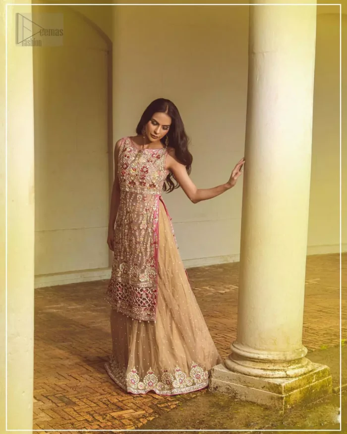 Steal the show with this endearing chiffon outfit with intricate yet rich embroidery. Crafted artfully with detailed multiple color thread embroidery on the bodice and traditional finessed work with kora, dabka, tilla and sequins. Hemline is intricately done with cut work and dangling balls, rest of the shirt is enhanced with floral bunches. Pair it up with fawn lehenga emphasized with different sized circular embroidered motifs at the bottom done with zardozi work to gave it a perfect look. Pair it up with fawn dupatta having four sided embellished borders and sprinkled with sequins all over the ground.