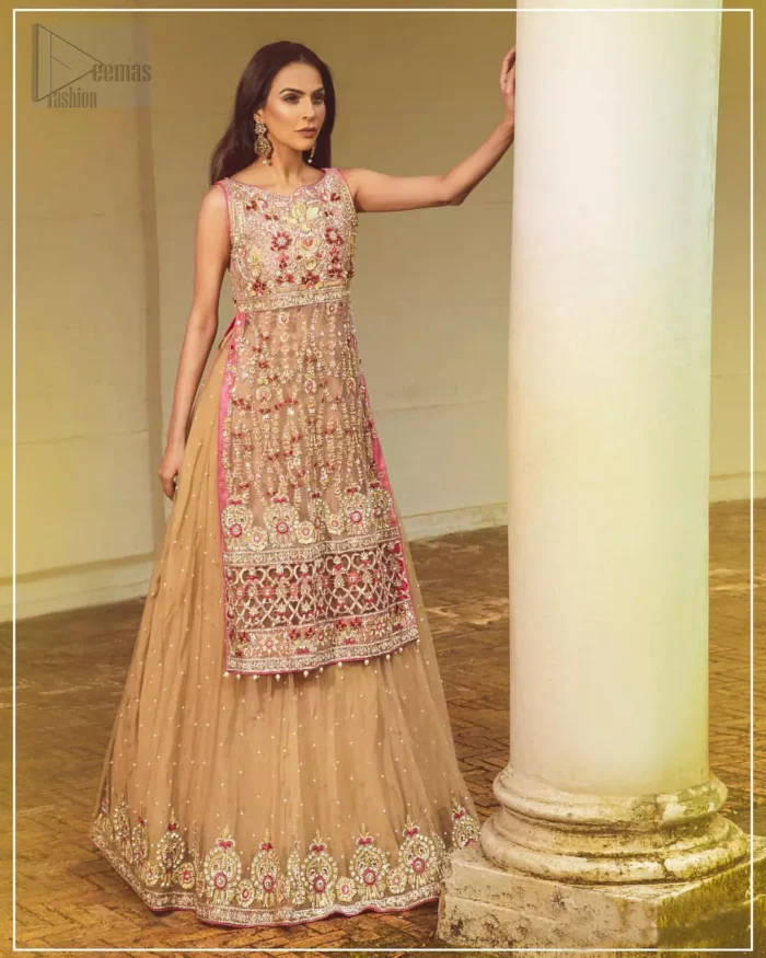 Steal the show with this endearing chiffon outfit with intricate yet rich embroidery. Crafted artfully with detailed multiple color thread embroidery on the bodice and traditional finessed work with kora, dabka, tilla and sequins. Hemline is intricately done with cut work and dangling balls, rest of the shirt is enhanced with floral bunches. Pair it up with fawn lehenga emphasized with different sized circular embroidered motifs at the bottom done with zardozi work to gave it a perfect look. Pair it up with fawn dupatta having four sided embellished borders and sprinkled with sequins all over the ground.