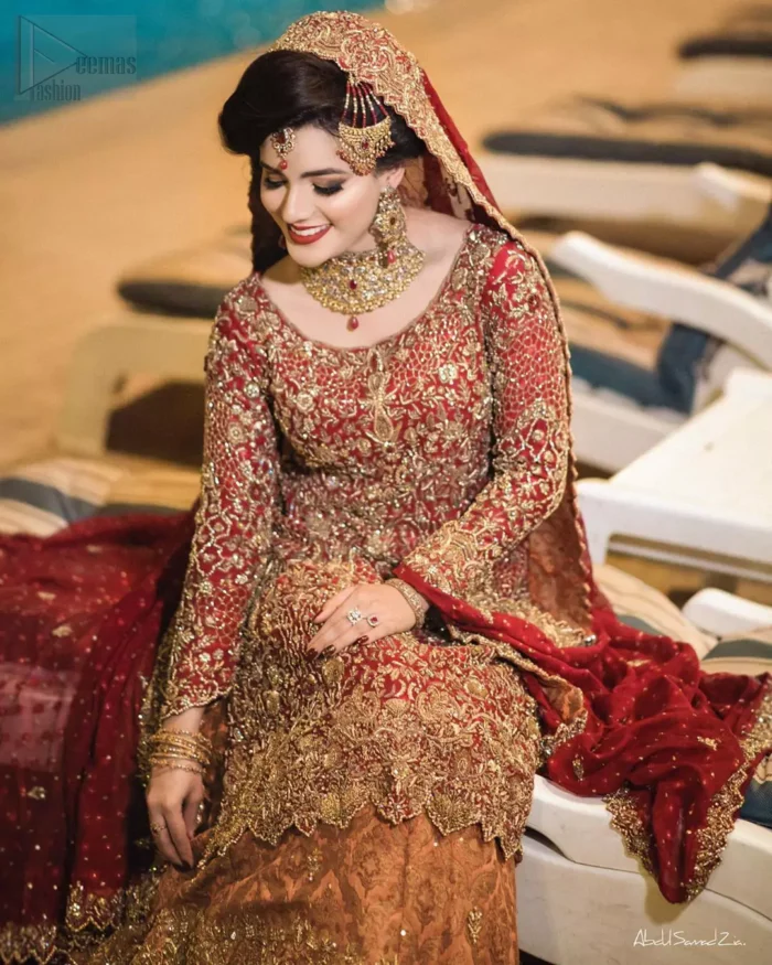You are all set to make a lasting impact with the divine royalty of this dress. This ravishing ensemble is sure to make you look like glamorous royalty with immaculate work covering every inch of the shirt. It boasts a pretty scallop hemline and full sleeves with zardozi embellishment. Compliment the look with flared lehenga. The combination of rust with maroon is absolutely breathetaking. Elegance is personified when it gets paired up with an all-over sequins spray on dupatta dupatta with alternating scalloped borders detailing. This is an ensemble that deserves to be flaunted.