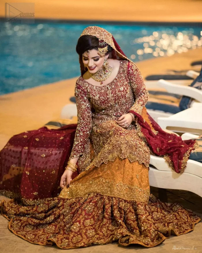 You are all set to make a lasting impact with the divine royalty of this dress. This ravishing ensemble is sure to make you look like glamorous royalty with immaculate work covering every inch of the shirt. It boasts a pretty scallop hemline and full sleeves with zardozi embellishment. Compliment the look with flared lehenga. The combination of rust with maroon is absolutely breathetaking. Elegance is personified when it gets paired up with an all-over sequins spray on dupatta dupatta with alternating scalloped borders detailing. This is an ensemble that deserves to be flaunted.