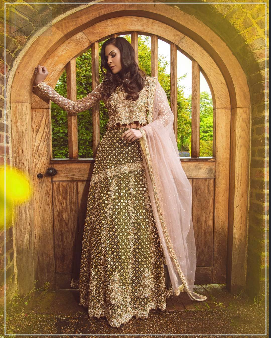 Nothing speaks of femininity and class louder than this mehndi outfits for bridesmaids. The motifs on the mehndi lehenga for a wedding are a true example of decorative and ornamental expression stylized in a contemporary way. The chic yet elegant mehndi green lehenga is decorated with zardozi embellished vertical lines, geometric patterns adorned with gotta work and floral bunches. Borders are even more enhanced with detailed motifs and finished with scallops. The blouse is fully decorated with floral embroidery all over with zardozi work in the shades of golden and antique. The look is completed with organza dupatta with embroidered lace borders and sequins spray all over.