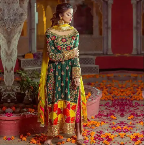 Beautifully elegant with a modern twist. This beautiful outfit comes with bottle green long shirt and colorful applique hemline, making