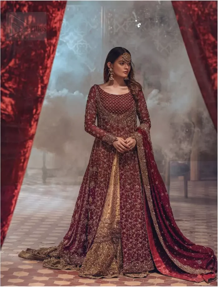 This wedding season, create a blissful aura with the treasure of love and elegance. An artistic vision of classic style and luxurious detailing, transpire into a truly romantic and iconic bridal for your big day. The front open floor length maxi is adorned with unique geometric patterns around the neckline and rest of the maxi is ornamented with floral embroidery. The kora, dabka, tilla and pearls embroidery is done in the shade of tan. Compliment the look with wide flared lehenga. The combination ofgolden with maroon is absolutely breathetaking. The dupatta incorporates beautifully designed borders on all four sides and sprinkled sequins to give it a perfect maharani look.