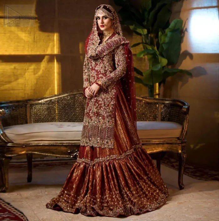 Captured in traditional silhouette. The bridal stands out due to its uniqueness and the perfect fusion of modern cut and traditional embroidery. This dress is beautifully highlighted with zardozi work in the shades of tan and silver. The hemline of the shirt is adorned with scalloped finishing and tassels on the sleeves. It comes with katan banarsi gharara with wide flare decorated with kora, dabka, tilla and pearls work. It is coordinated with organza dupatta which is sprinkled with sequins all over it. It is further furnished with four sided scalloped border.