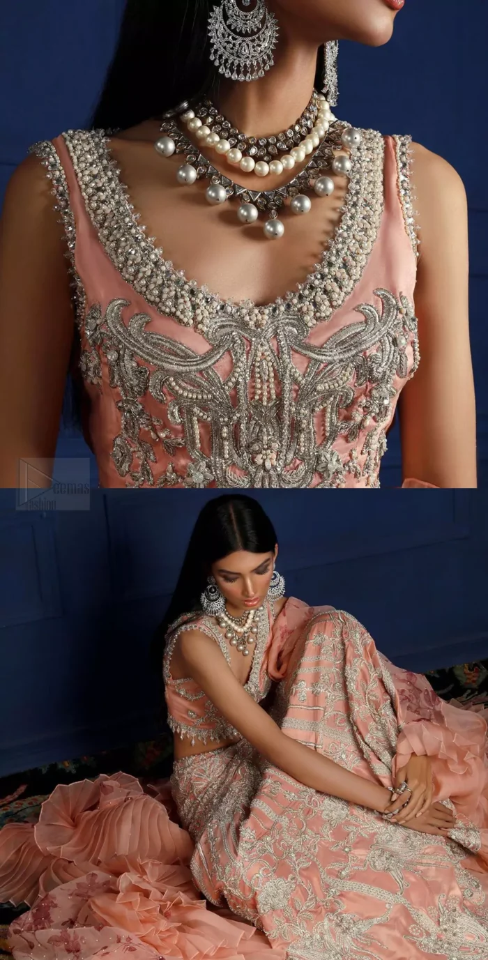 Crafted with love. This outfit is classically designed to make your memorable day beautiful as it should be. The peachy blouse is emphasized with intricate embroidery, handcrafted bootis adorned with silver embellishment finished with dangling pearls all around the edges. Compliment the look with flared lehenga which is decorated with silver kora, dabka, tilla and pearls work. Excellence of craftsmanship is evident with intricate detailing that features the use of zardozi work. The look is complete with organza dupatta finishing with frilled border.