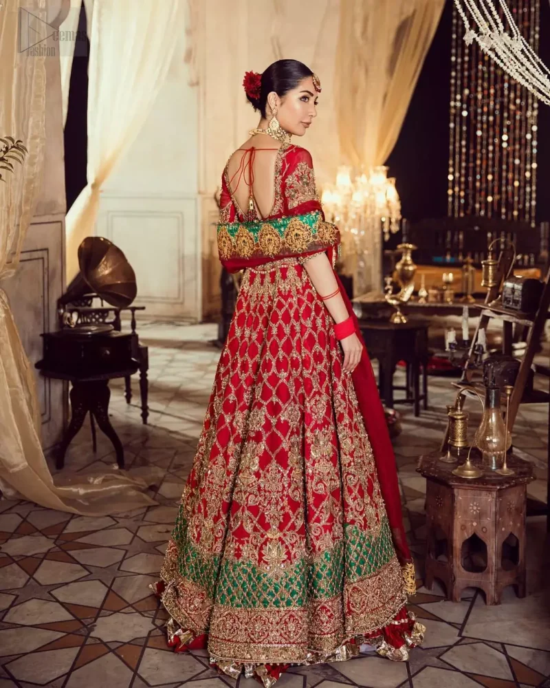 Classic, timeless and truly beautiful, our bridal dress is perfect for your unforgettable day. Our bride makes a statement in this stunningly floraison, perfect blend of glamour and tradition with outstanding craftsmanship and gorgeous detailing. The floor length maxi is delicately crafted with golden kora, dabka, tilla, sequins and pearls work. Furthermore it is adorned sea green applique with rich patterns and delicate details at the daaman. Crushed chiffon sharara are included to complete the look. This beautiful dupatta with rich embroidered motifs places artistically on the borders gives it a royal look.