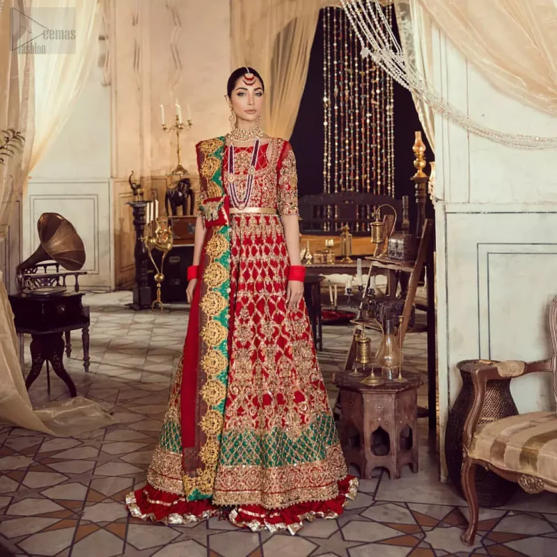 Classic, timeless and truly beautiful, our bridal dress is perfect for your unforgettable day. Our bride makes a statement in this stunningly floraison, perfect blend of glamour and tradition with outstanding craftsmanship and gorgeous detailing. The floor length maxi is delicately crafted with golden kora, dabka, tilla, sequins and pearls work. Furthermore it is adorned sea green applique with rich patterns and delicate details at the daaman. Crushed chiffon sharara are included to complete the look. This beautiful dupatta with rich embroidered motifs places artistically on the borders gives it a royal look.