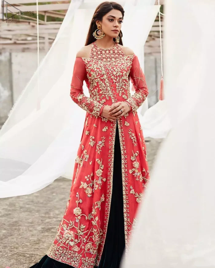 This outfit brings drama and playfulness to traditional frock and Sharara with a modern approach. Drape yourself to perfection for the classic affair in this flattering front open ensemble festooned with intricate zardozi hand embroidery work and motifs. The frock is furthermore adorned with halter neckline and comprises with overlaped bodice. Embellishment is done with zardozi embroidery in silver color. This outfit is comprises with bottle green velvet sharara and coral chiffon dupatta with sequins spray all over.