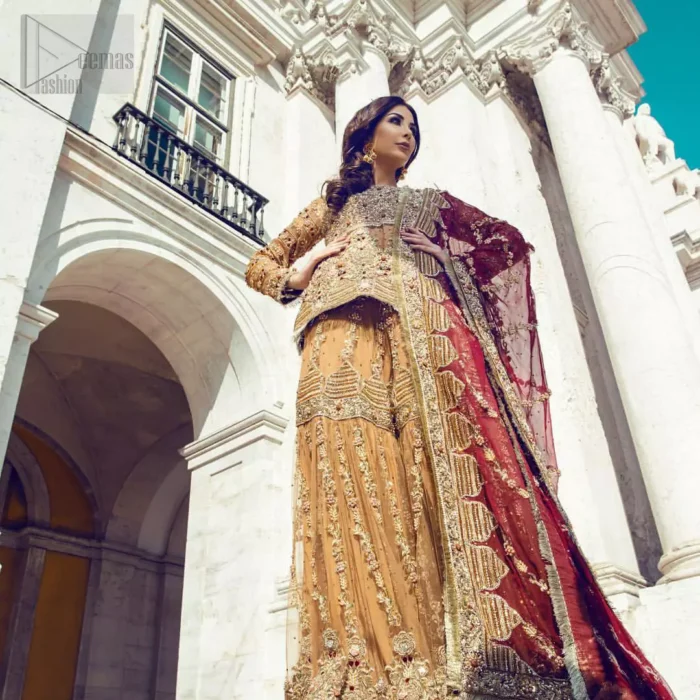 Picturing your bridal in a glowing fawn color. Featuring beautiful handwork, this outfit has a delicate arrangement of hand embellished geometric patterns with pearls and crystals on the bottom. Refined craftsmanship is at its best with hand embellished bodice which is laden with zardozi work. This outfit is paired with organza gharara with embroidered bottom and kiran lace, and maroon dupatta ornamented with geometric patterns along the length, making it a statement piece. Furthermore it is also enhanced with kiran lace on all four sides.