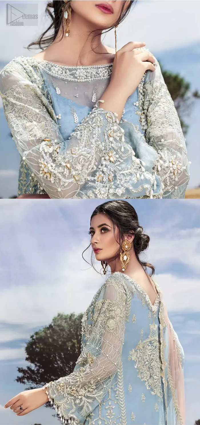 Intricate details, flamboyant silhouettes and mastery of colour are what makes this dress stand out from the rest. This is one of the elegant pieces are sure to stay in your heart and your wardrobe forever. The front of the shirt is beautifully ornamented with floral motifs and bootis, also a delicate arrangement of geometric patterns on the hemline with light golden and silver zardozi work. The back of the shirt is accentuated with a large central motif and scattered tiny floral motifs all over. It comprises with ferozi capri pants emphasized with bottom. To complete the look, go with a gradient dupatta having geometric patterns on pallu and scalloped border along the length. Furthermore the outfit is fully decorated with scalloped finishing and tassels.
