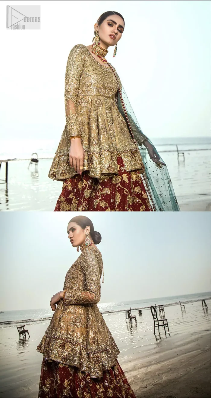 This wedding season, create a blissful aura with the treasure of love and elegance. An artistic vision of classic style and luxurious detailing infused with a bohemian spirit, transpire into a truly romantic and iconic bridal for your big day. The golden double layered peplum is heavily laden with zardozi and the perfect blend of traditional flamboyance and modern elegance in design. Pair it up with maroon lehenga enhanced with golden zardozi work. To complete the look, go with teel dupatta scattered with sequins all over the ground and heavily embellished borders to give it a perfect maharani look.