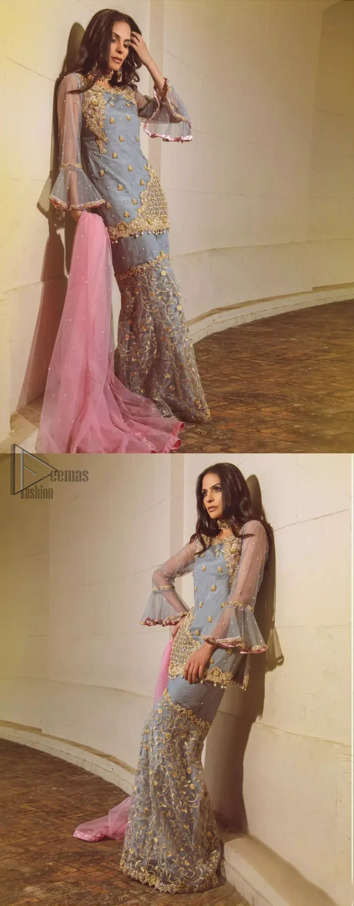 Embrace the season of festivities with this beautiful dress. The chic yet elegant outfit is decorated with golden embroidery, embellished neckline and tiny floral motifs. Borders are even more enhanced with golden zardozi detailed patterns and finished with scallops and dangling balls. Pair it up with gray sharara highlighted with floral jaal and scalloped bottom done with golden kora, dabka and tilla work. The look is complete with pink net dupatta sprinkled with sequins all over.