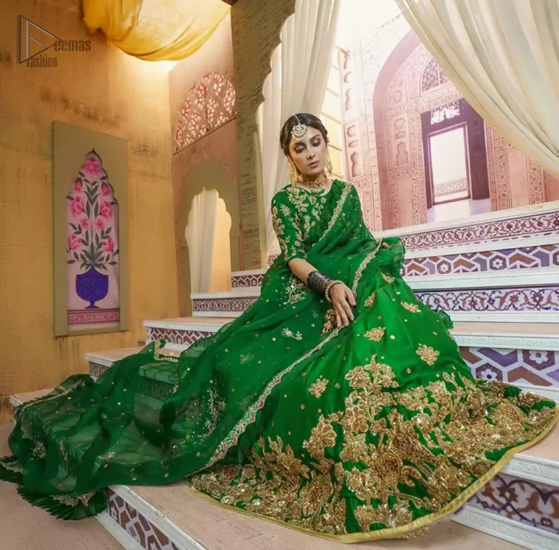 Nothing speaks of femininity and class louder than this green mehndi outfits for bridesmaids. This beautiful outfit comes with a green lehenga which is beautifully embellished with motifs, sprinkled with sequins and it finished with a thick embellished border. The blouse is breathtakingly ornamented with floral bootis which covers every inch of the blouse. The dupatta incorporates beautifully designed scalloped borders and frilled on all four sides. The kora, dabka, tilla, sequins and pearls work are done in the shades of golden.