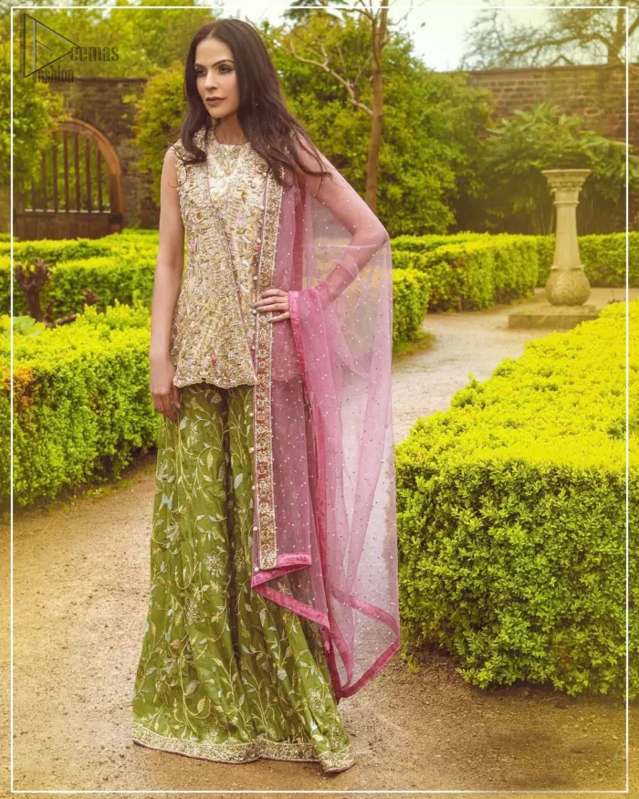 Wear this soft and supple hues richly decorated by shade pink with zardozi embroidered motifs and floral bootis all over the shirt. The outfit is finished by beautiful overlaping and scalloped hemline. It comes with an exquisite sharara with embroidered border and floral bootis all over to give it a regal look. The outfit is coordinated with pink net dupatta having sequins spray all over the ground and zardozi embellished borders along the length.