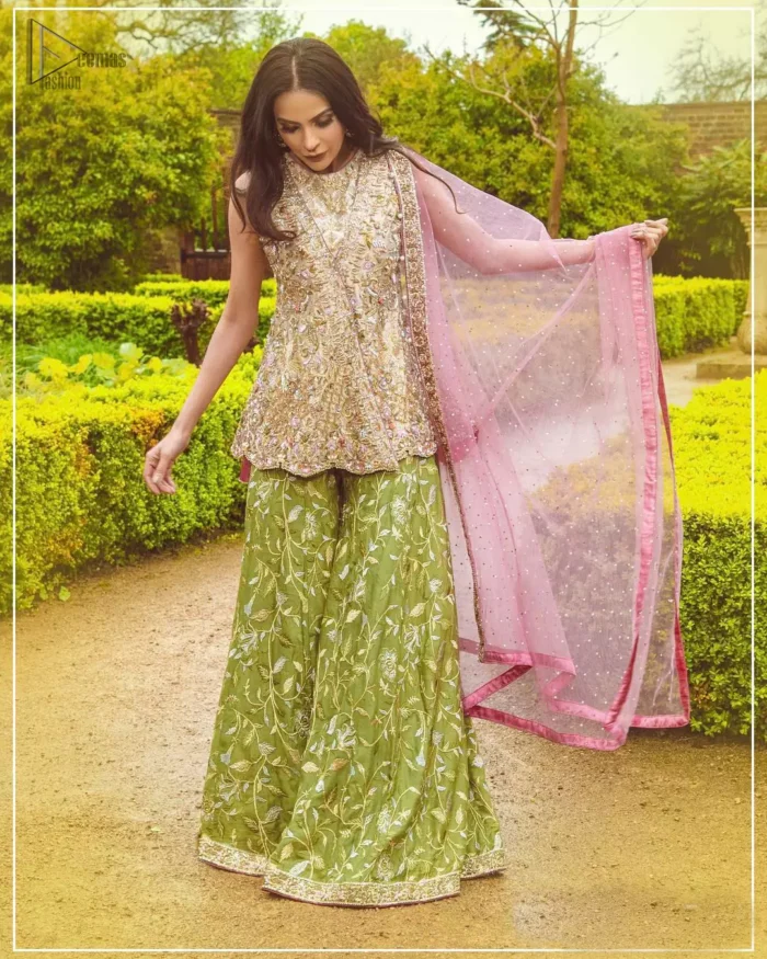 Wear this soft and supple hues richly decorated by shade pink with zardozi embroidered motifs and floral bootis all over the shirt. The outfit is finished by beautiful overlaping and scalloped hemline. It comes with an exquisite sharara with embroidered border and floral bootis all over to give it a regal look. The outfit is coordinated with pink net dupatta having sequins spray all over the ground and zardozi embellished borders along the length.