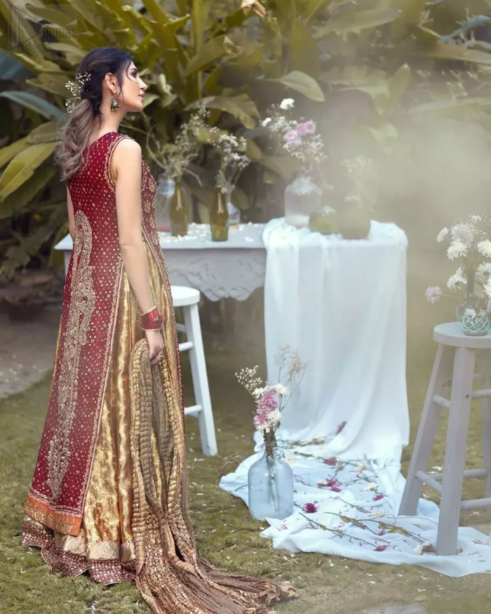 Impeccably on trend, this chic, romantic and oh-so-elegant ensemble is perfect for the one who want to mix vintage touches in with more daring and contemporary designs. Unique craftsmanship and detailed embellishments on the maroon front open shirt, done with golden zardozi. Furthermore the back of the shirt is also emphasized with zardozi work and scattered sequins all over the back. It comprises with golden inner maxi enhanced with maroon embellished applique on the bottom. Pair it up with golden brocade churidar pajama and golden crushed dupatta.