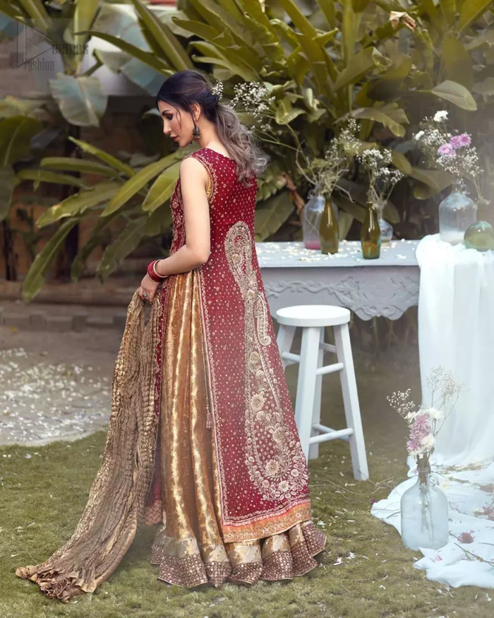 Impeccably on trend, this chic, romantic and oh-so-elegant ensemble is perfect for the one who want to mix vintage touches in with more daring and contemporary designs. Unique craftsmanship and detailed embellishments on the maroon front open shirt, done with golden zardozi. Furthermore the back of the shirt is also emphasized with zardozi work and scattered sequins all over the back. It comprises with golden inner maxi enhanced with maroon embellished applique on the bottom. Pair it up with golden brocade churidar pajama and golden crushed dupatta.