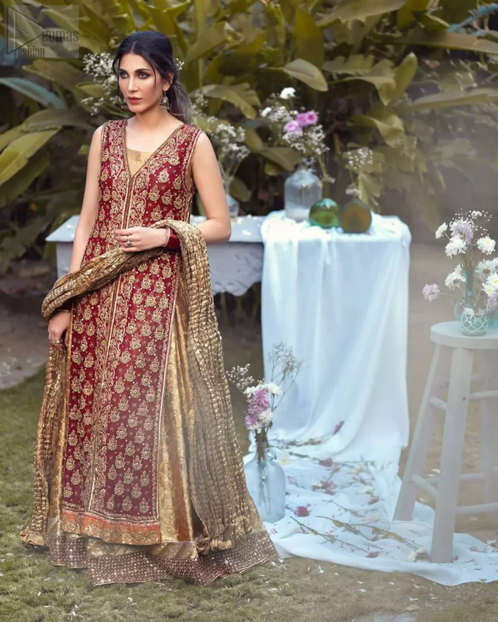 Impeccably on trend, this chic, romantic and oh-so-elegant ensemble is perfect for the one who want to mix vintage touches in with more daring and contemporary designs. Unique craftsmanship and detailed embellishments on the maroon front open shirt, done with golden zardozi. Furthermore the back of the shirt is also emphasized with zardozi work and scattered sequins all over the back. It comprises with golden inner maxi enhanced with maroon embellished applique on the bottom. Pair it up with golden brocade churidar pajama and golden crushed dupatta.