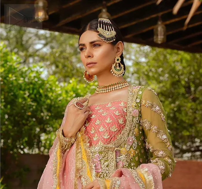 We have brought a charismatic charm to the traditional motifs and cuts. Our embroidery is rich in detailed traditional techniques executed to perfection. The bride shines bright in this outfit, embedded with sophisticated zardozi and thread embeishments. The bodice and hemline is furthermore emphasized with intricate details that gives the perfect ending to this mehndi dress. Pair it up with yellow sharara with captivating embellished border. The dupatta incorporates beautifully designed borders with zardozi, applique and kiran along the length, focusing on the geometrically embellished pallu and sequins spray all over to give it a perfect look.