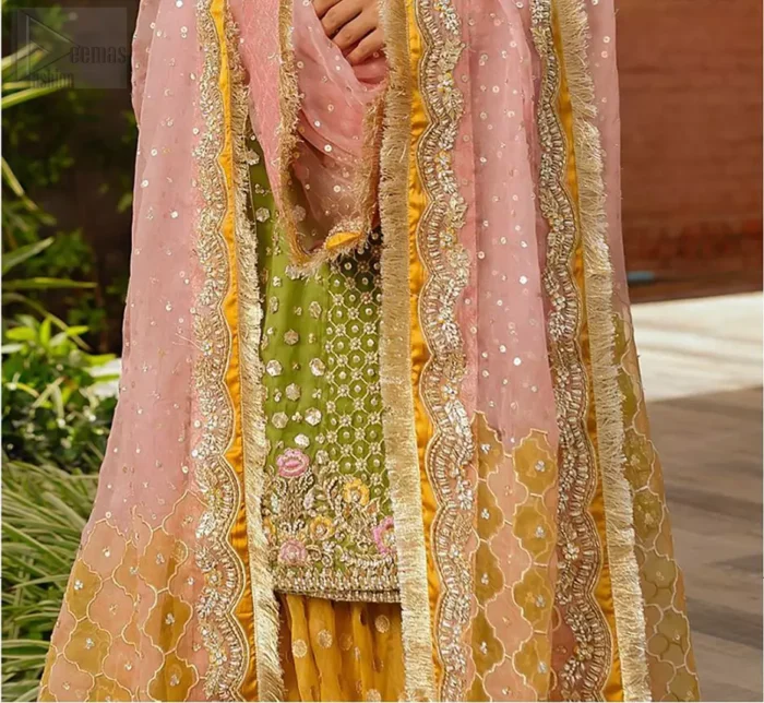 We have brought a charismatic charm to the traditional motifs and cuts. Our embroidery is rich in detailed traditional techniques executed to perfection. The bride shines bright in this outfit, embedded with sophisticated zardozi and thread embeishments. The bodice and hemline is furthermore emphasized with intricate details that gives the perfect ending to this mehndi dress. Pair it up with yellow sharara with captivating embellished border. The dupatta incorporates beautifully designed borders with zardozi, applique and kiran along the length, focusing on the geometrically embellished pallu and sequins spray all over to give it a perfect look.