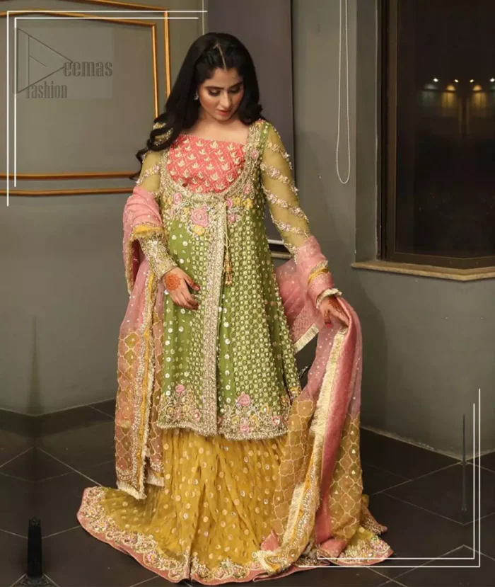 We have brought a charismatic charm to the traditional motifs and cuts. Our embroidery is rich in detailed traditional techniques executed to perfection. The bride shines bright in this outfit, embedded with sophisticated zardozi and thread embeishments. The bodice and hemline is furthermore emphasized with intricate details that gives the perfect ending to this mehndi dress. Pair it up with yellow sharara with captivating embellished border. The dupatta incorporates beautifully designed borders with zardozi, applique and kiran along the length, focusing on the geometrically embellished pallu and sequins spray all over to give it a perfect look.