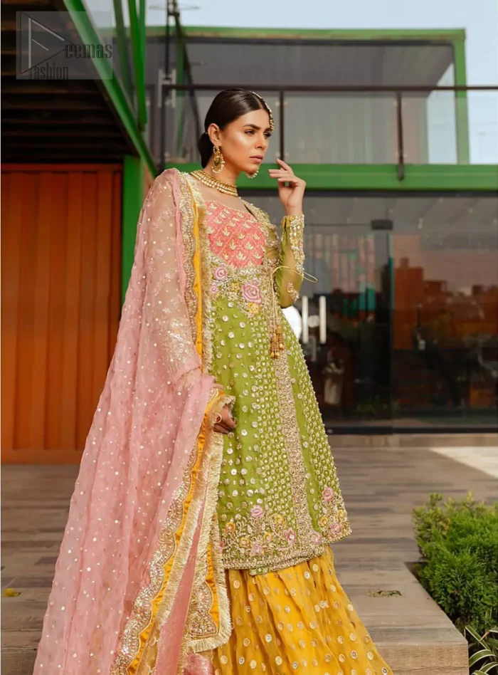 We have brought a charismatic charm to the traditional motifs and cuts. Our embroidery is rich in detailed traditional techniques executed to perfection. The bride shines bright in this outfit, embedded with sophisticated zardozi and thread embeishments. The bodice and hemline is furthermore emphasized with intricate details that gives the perfect ending to this mehndi dress. Pair it up with yellow sharara with captivating embellished border. The dupatta incorporates beautifully designed borders with zardozi, applique and kiran along the length, focusing on the geometrically embellished pallu and sequins spray all over to give it a perfect look.