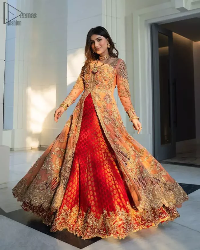 Details make perfection and perfection is not a detail”-DaVinci. This beautiful quote embodies what the DeemasFashion tries to achieve in its every ensemble which is customised to perfection. This beautiful play of red and orange  makes for a stunning. The upper layer of maxi is beautifully crafted with multiple color zardozi work and embroidered jaal. The bottom of inner are even more enhanced with golden zardozi embellishment and finished with scallops. It comprises with churidar pajama and fawn chiffon dupatta. The embellished alluring cut work floral border gives the perfect ending to veil or dupatta.