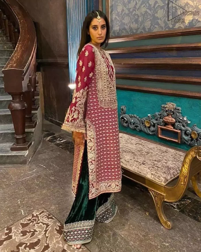 The new season is all about making a statement. An sensational affair so timeless and magnificent, beautifully crafted in hues of golden. Embellishd bodice with zardozi work and bell sleeves adorned with tassels finishing make the outfit more beautiful. Balance the look with bottle green palazzo pants highlighted with embroidered borders at the bottom and red organza dupatta with sequins spray all over. Craftmanship and skills you've never witnessed before.