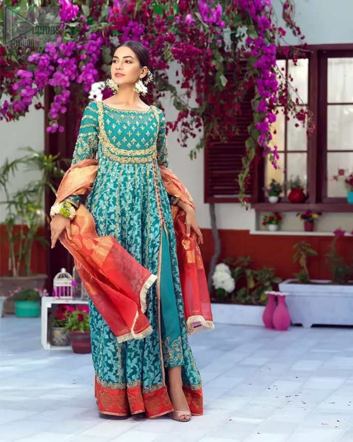 The perfect combination of tradition and class. With a lot of attention to detail, the intricate zardozi work with using glass beading and threads makes the bodice look like nothing but a dream. The tiny floral motifs are also scattered on the bodice. This mehndi outfit is ornamented with vertical embroidered lines and coral applique at the bottom. It comprises with sea green capri pants emphasized with embellished bottom and coral self fabric dupattta. You are all set to make a lasting impact with the divine royalty of this dress.