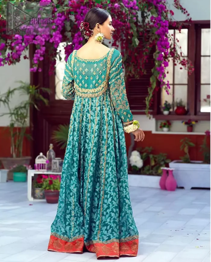 The perfect combination of tradition and class. With a lot of attention to detail, the intricate zardozi work with using glass beading and threads makes the bodice look like nothing but a dream. The tiny floral motifs are also scattered on the bodice. This mehndi outfit is ornamented with vertical embroidered lines and coral applique at the bottom. It comprises with sea green capri pants emphasized with embellished bottom and coral self fabric dupattta. You are all set to make a lasting impact with the divine royalty of this dress.