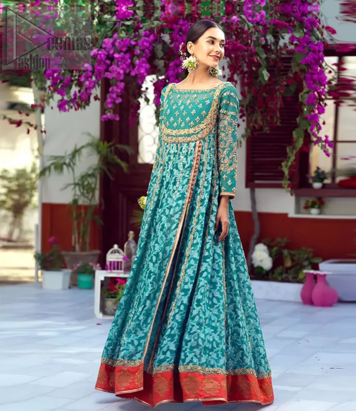 The perfect combination of tradition and class. With a lot of attention to detail, the intricate zardozi work with using glass beading and threads makes the bodice look like nothing but a dream. The tiny floral motifs are also scattered on the bodice. This mehndi outfit is ornamented with vertical embroidered lines and coral applique at the bottom. It comprises with sea green capri pants emphasized with embellished bottom and coral self fabric dupattta. You are all set to make a lasting impact with the divine royalty of this dress.
