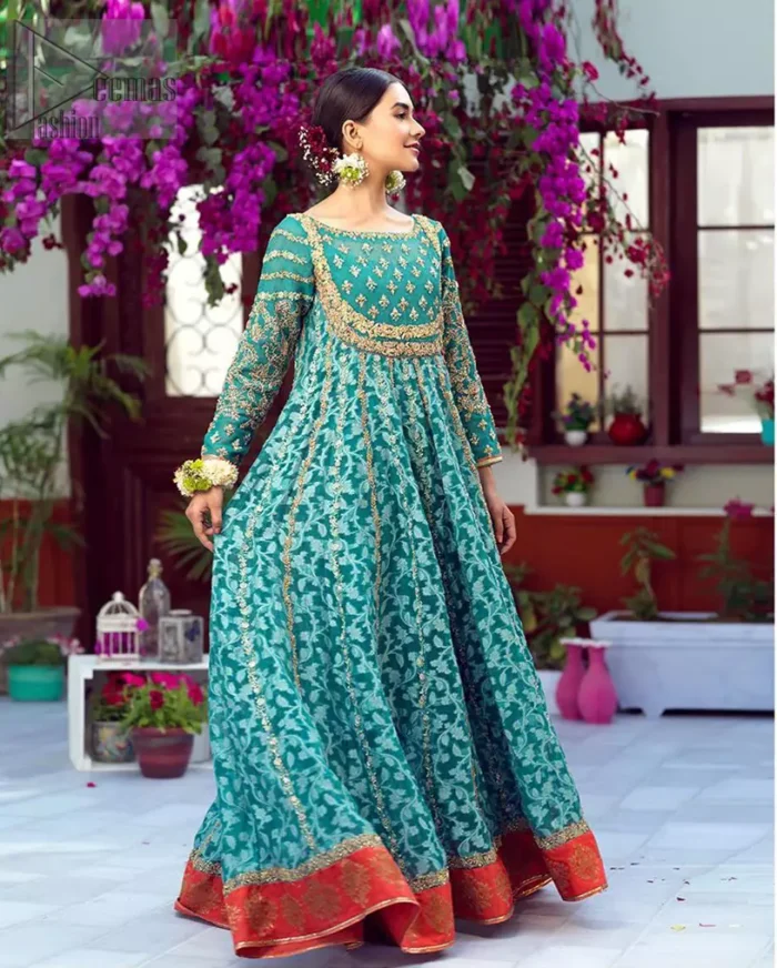The perfect combination of tradition and class. With a lot of attention to detail, the intricate zardozi work with using glass beading and threads makes the bodice look like nothing but a dream. The tiny floral motifs are also scattered on the bodice. This mehndi outfit is ornamented with vertical embroidered lines and coral applique at the bottom. It comprises with sea green capri pants emphasized with embellished bottom and coral self fabric dupattta. You are all set to make a lasting impact with the divine royalty of this dress.