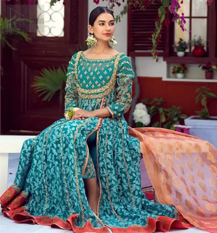 The perfect combination of tradition and class. With a lot of attention to detail, the intricate zardozi work with using glass beading and threads makes the bodice look like nothing but a dream. The tiny floral motifs are also scattered on the bodice. This mehndi outfit is ornamented with vertical embroidered lines and coral applique at the bottom. It comprises with sea green capri pants emphasized with embellished bottom and coral self fabric dupattta. You are all set to make a lasting impact with the divine royalty of this dress.